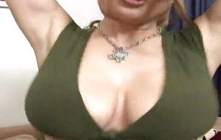 Big breasted Cassandra Calogera sticks a toy in her cunt